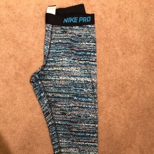 Nike leggings, sweatshirt, and hat